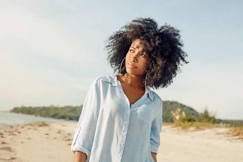woman looking off to the side with a slight smile